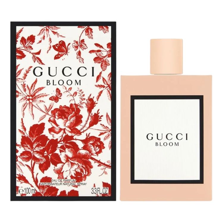 Embalaggem da Gucci Bloom, com flores vermelhas, e frasco rosa