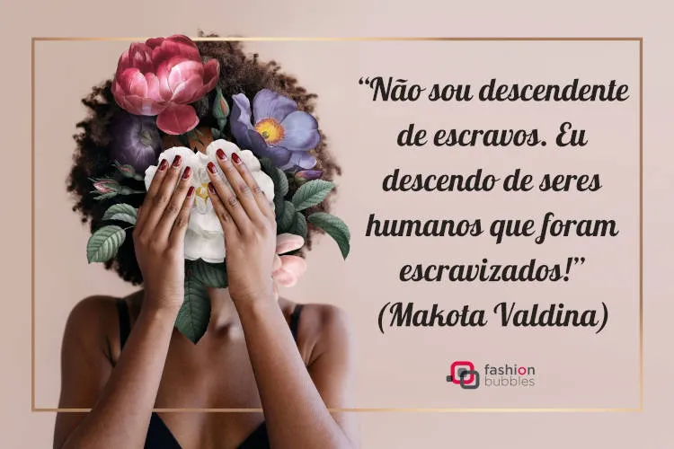 Cartão virtual de fundo rosa com desenho de mulher de pele negra com flores coloridas, borda dourada e frase “Não sou descendente de escravos. Eu descendo de seres humanos que foram escravizados!” (Makota Valdina)