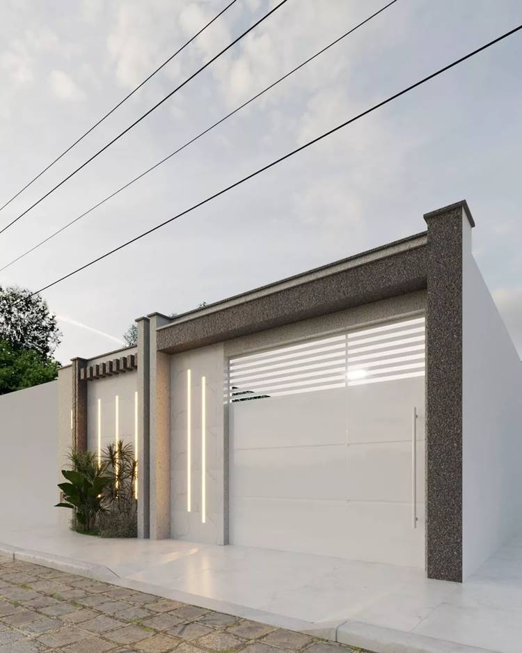 Portão com detalhes em pedras e leds decorando