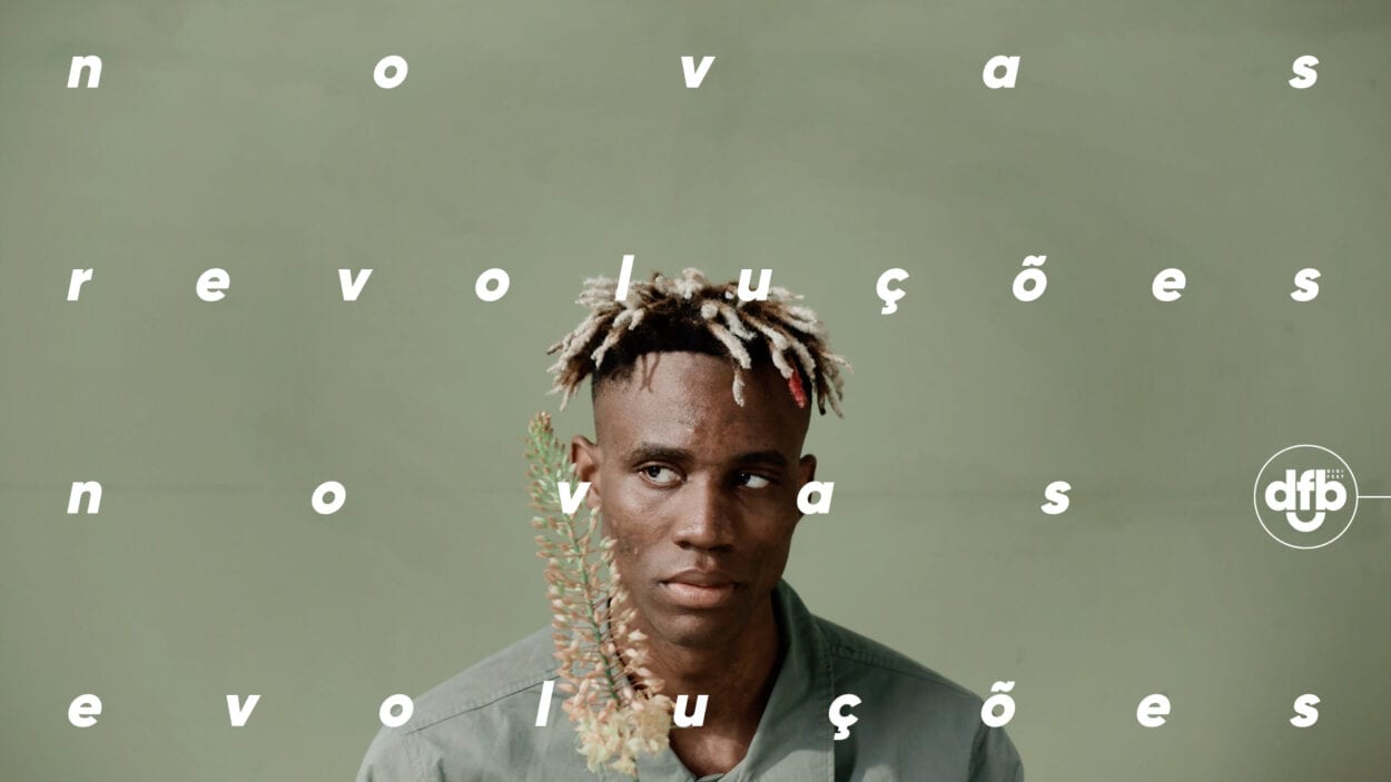 Foto de homem negro com cabelo moicano e os dizeres: novas revoluções novas evoluções