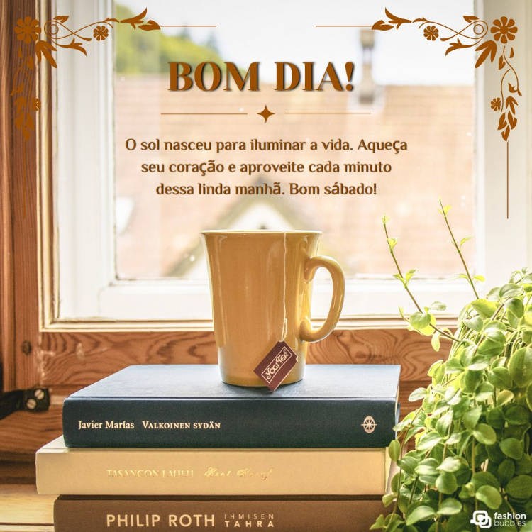 Foto de caneca amarela sobre livros e em frente à janela com frase "Bom dia! O sol nasceu para iluminar a vida. Aqueça seu coração e aproveite cada minuto dessa linda manhã. Bom sábado!"