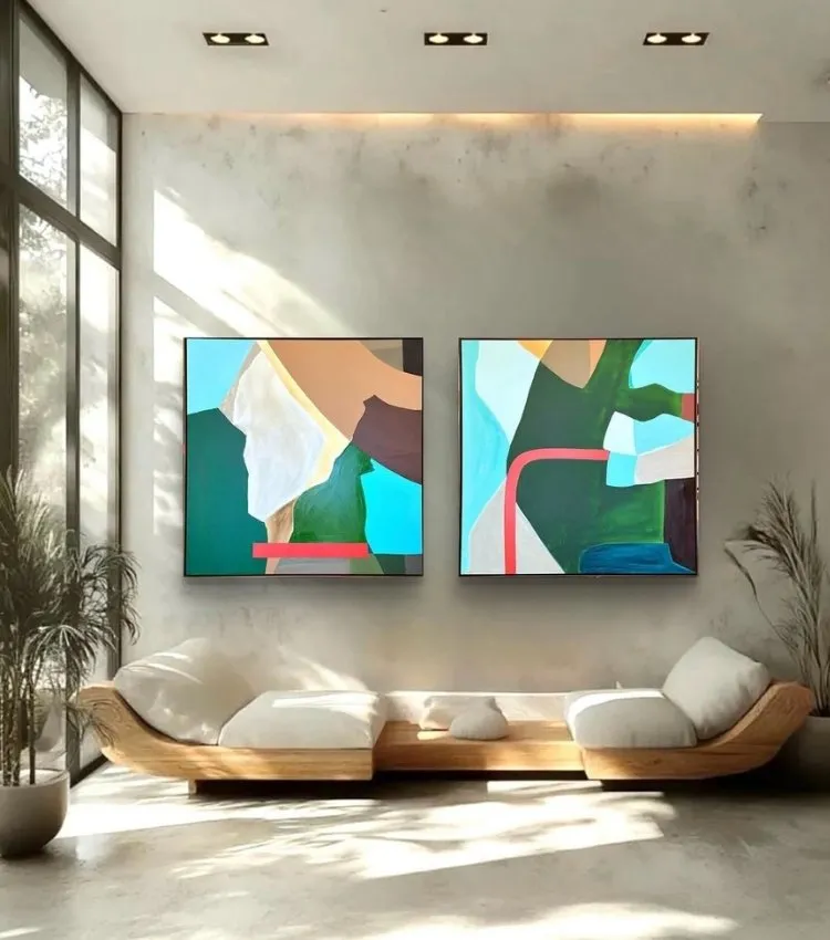 Sala de estar decorada com quadro do artista plástico Adielson Rodrigues em tons de verde, cor tendência da decoração para 2026