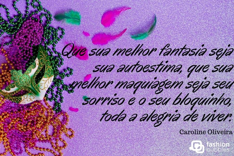 Foto de fundo roxo com cordões coloridos, penas e máscara em verde, além de frase: Que sua melhor fantasia seja sua autoestima, que sua melhor maquiagem seja seu sorriso e o seu bloquinho, toda a alegria de viver.