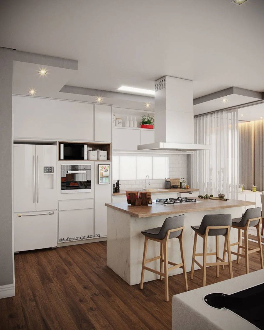 Cozinha americana branca com ilha e banquetas cinza.