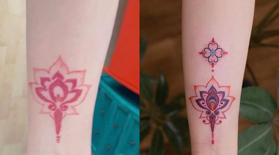 Cobertura de uma tatuagem de um símbolo em vermelho, por uma do mesmo símbolo mas mais colorido e intenso.