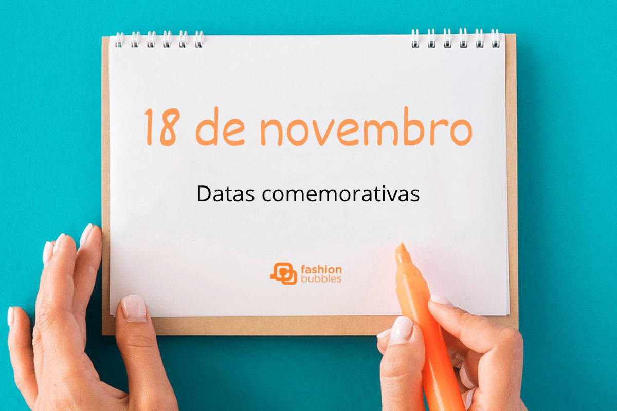 Foto de prancheta com fundo azul e escrito "18 de novembro" laranja