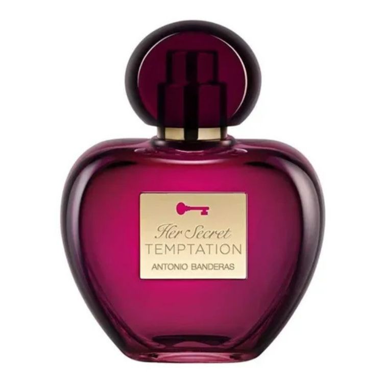 Um frasco de perfume "Her Secret TEMPTATION" de Antonio Banderas, em um tom profundo de magenta, com formato de coração e um detalhe dourado de chave. O design sugere mistério e sedução.

