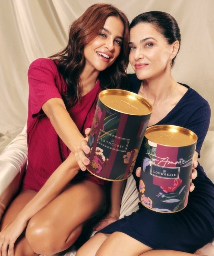 Modelos da marca Loungerie segurando lata presenteável