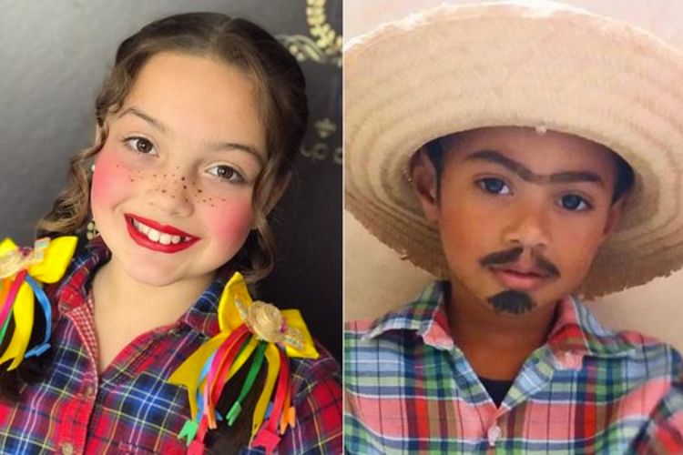 menina e menino com look de festa junina