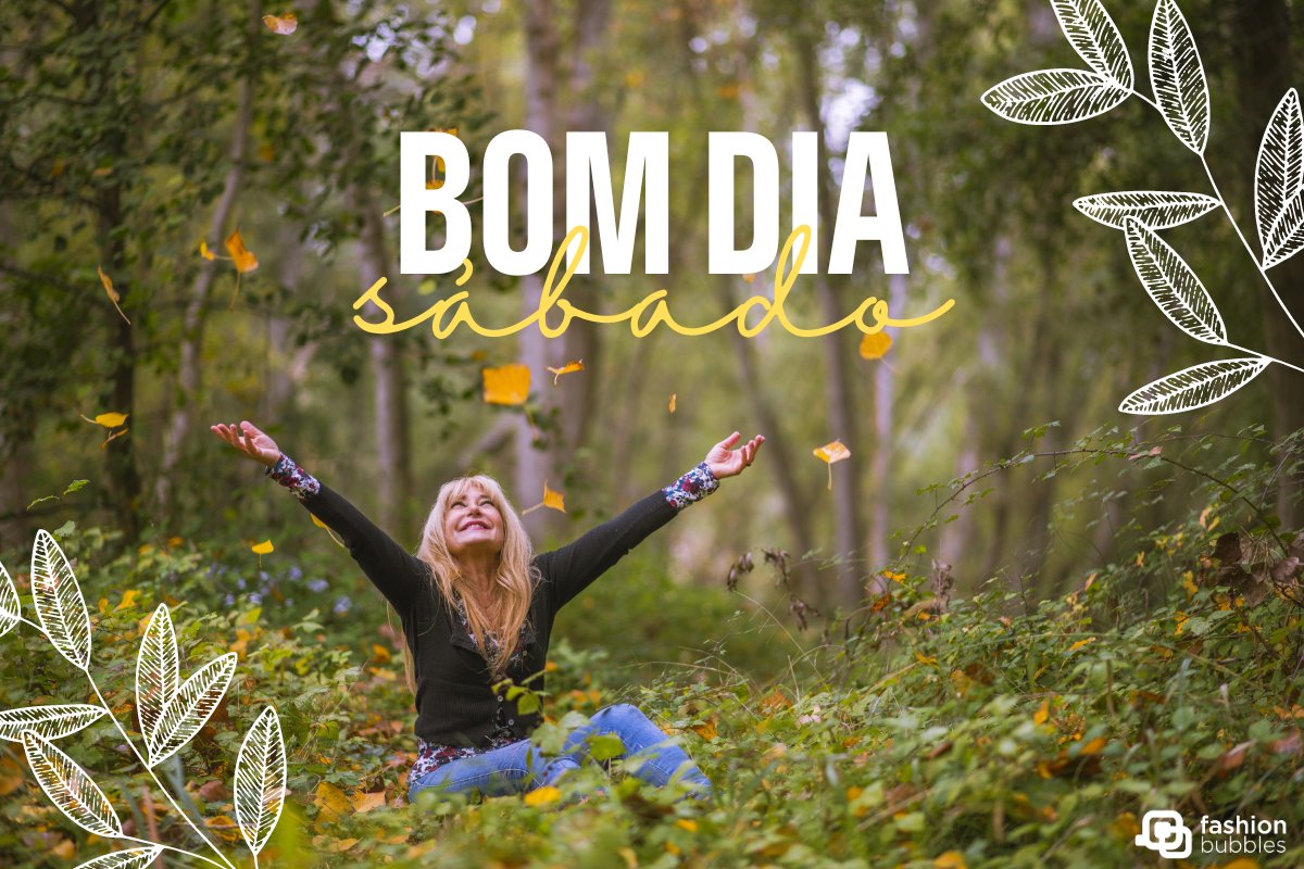 Mulher loira de pele clara usando blusa preta e calça jeans, sentada em gramado, rodeada por árvores e folhas amarelas, com frase "bom dia, sábado"