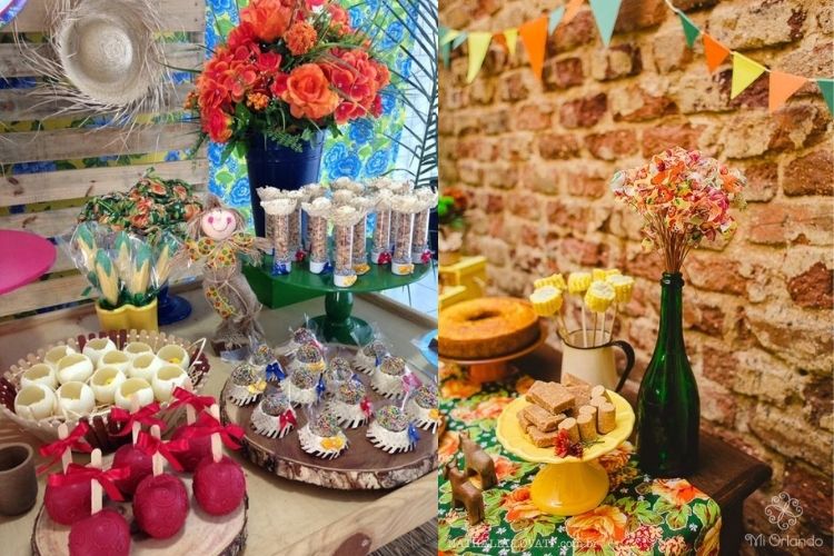 A imagem representa festa junina decorada com flores. Contém mesa com doces como maça do amor, brigadeiro, balinhas e paçoca