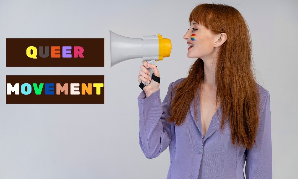 Imagem de uma militante do movimento Queer falando em um megafone.
