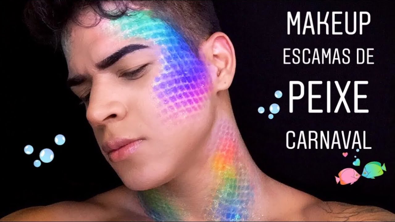 Homem de pele clara com maquiagem de escamas neon