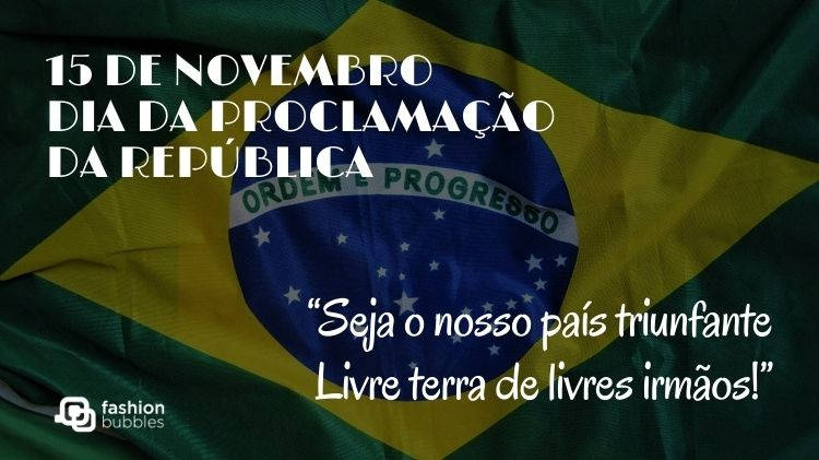 Cartão virtual com fundo de bandeira do Brasil e frases "15 de novembro Dia da Proclamação da República" e “Seja o nosso país triunfante / Livre terra de livres irmãos!” (Hino da Proclamação da República)