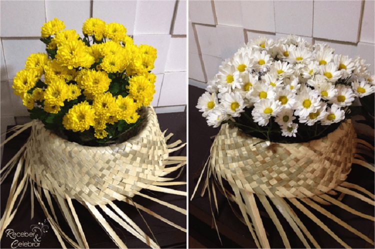 A imagem representa decoração para festas juninas com flores, arranjo de chapéu com flores amarelas e brancas em cima