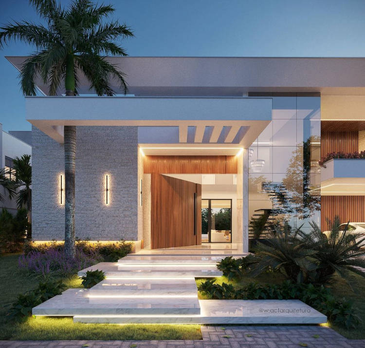 Fachada de casa moderna com escada iluminada.